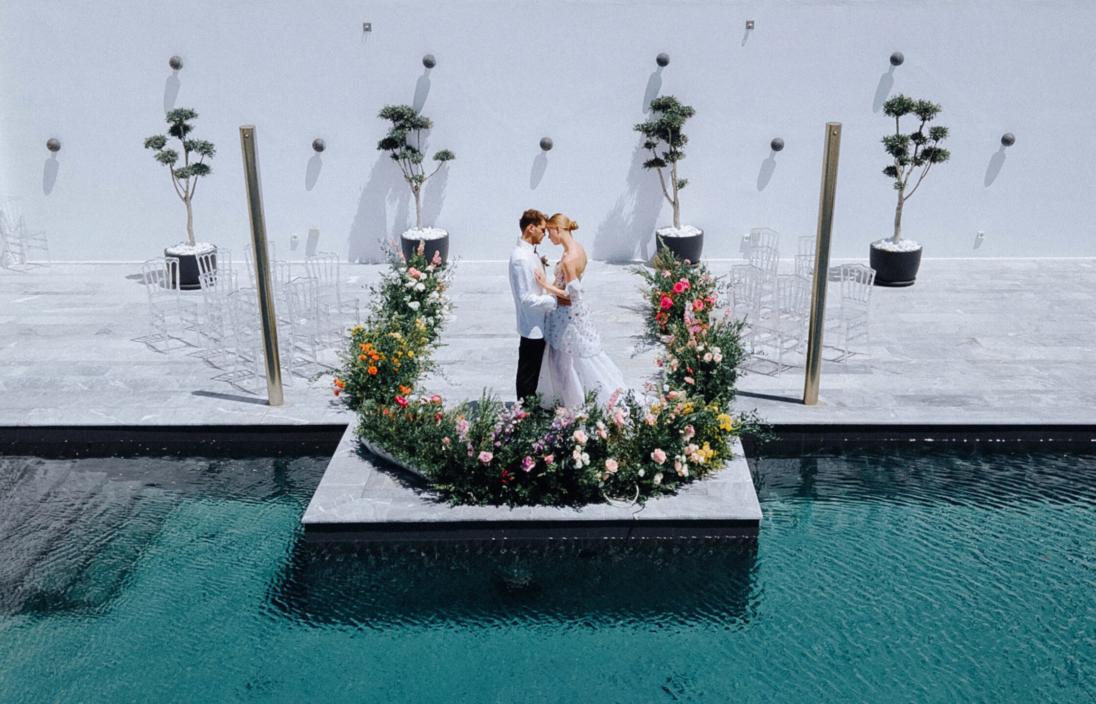 Exclusive Mykonos luxury wedding ceremony with bride and groom exchanging vows at a high-end destination wedding venue in Greece